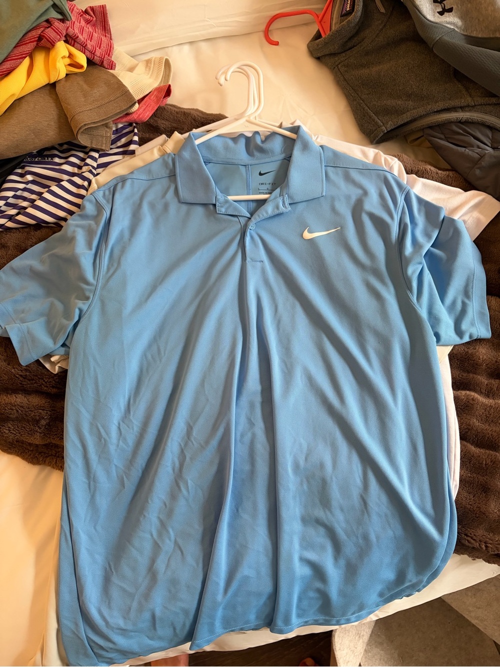 Nike Men’s Sky Blue Polo with White Swoosh
